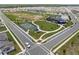 A full aerial view shows the basketball courts, playground, and pool in this residential community at 7199 Sw 60Th Ln, Ocala, FL 34474