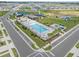 Aerial view showcases a community pool with splash pad, playground, and seating at 7199 Sw 60Th Ln, Ocala, FL 34474