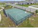 Aerial image of a fenced outdoor basketball court in a residential community with street views and landscaping at 7199 Sw 60Th Ln, Ocala, FL 34474