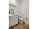 A clean half-bathroom features a simple vanity with white cabinets at 7199 Sw 60Th Ln, Ocala, FL 34474