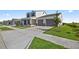 New construction home featuring a two-car garage, manicured lawn, and stylish design at 7199 Sw 60Th Ln, Ocala, FL 34474