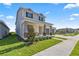 Beautiful two-story home with stone accents, covered porch, and well-manicured lawn at 7199 Sw 60Th Ln, Ocala, FL 34474
