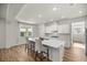 Well-lit kitchen with an island, stainless steel appliances, and a view of the outdoor scenery at 7199 Sw 60Th Ln, Ocala, FL 34474