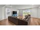 Comfortable living area with a large sofa, a TV, and access to the outdoors at 7199 Sw 60Th Ln, Ocala, FL 34474