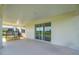 A covered patio with ample space for relaxation and enjoyment, complemented by sliding glass doors at 7199 Sw 60Th Ln, Ocala, FL 34474