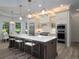 Gourmet kitchen with a large island, stainless steel appliances, and pendant lighting at 8033 Nw 29Th Street Rd, Ocala, FL 34482