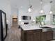 Open-concept design showcases the kitchen's seamless integration with the living space at 8033 Nw 29Th Street Rd, Ocala, FL 34482