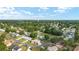 Scenic aerial shot of a residential community with lush greenery and a water tower at 8375 Sw 109Th Lane Rd, Ocala, FL 34481