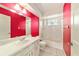 Bright bathroom featuring tub/shower and vanity with bright accent wall at 8375 Sw 109Th Lane Rd, Ocala, FL 34481