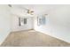 Bright bedroom featuring two windows and a ceiling fan at 8375 Sw 109Th Lane Rd, Ocala, FL 34481