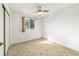 Bedroom with a standard window view and ceiling fan at 8375 Sw 109Th Lane Rd, Ocala, FL 34481