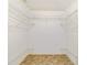 Walk-in closet featuring overhead and base level shelving at 8375 Sw 109Th Lane Rd, Ocala, FL 34481