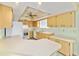 Spacious kitchen featuring matching appliances, a breakfast bar, and ample countertop area at 8375 Sw 109Th Lane Rd, Ocala, FL 34481