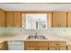 Traditional kitchen with light wood cabinets and pass-through to another room at 8375 Sw 109Th Lane Rd, Ocala, FL 34481