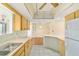 Open kitchen with ample cabinet space and tile flooring that leads to dining area at 8375 Sw 109Th Lane Rd, Ocala, FL 34481