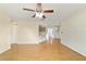 Open-concept living room with wood floors flows into dining area and kitchen at 8375 Sw 109Th Lane Rd, Ocala, FL 34481