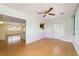 Open living room with hardwood floors and view to the kitchen with breakfast bar at 8375 Sw 109Th Lane Rd, Ocala, FL 34481
