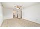 Large bedroom with a ceiling fan, ensuite bathroom and large windows at 8375 Sw 109Th Lane Rd, Ocala, FL 34481