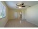 Well-lit bedroom with tile floors and closet at 8463 Sw 108Th Pl, Ocala, FL 34481
