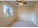 Bright bedroom featuring a large window at 8463 Sw 108Th Pl, Ocala, FL 34481