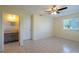 Bedroom with tile flooring with adjacent bathroom at 8463 Sw 108Th Pl, Ocala, FL 34481
