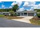 A quaint single-story home with a lovely front porch and a well-manicured lawn at 8463 Sw 108Th Pl, Ocala, FL 34481