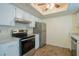 Well-lit kitchen featuring white cabinets and stainless steel appliances at 8463 Sw 108Th Pl, Ocala, FL 34481