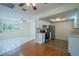 Open floor plan with kitchen and living area, enhancing a spacious feel at 8463 Sw 108Th Pl, Ocala, FL 34481