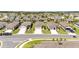 Aerial view of a suburban neighborhood showcasing well-maintained homes and landscaped yards at 8820 Sw 58Th Street Rd, Ocala, FL 34481