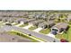 Aerial view of a residential community with homes, landscaping, and well-maintained streets at 8820 Sw 58Th Street Rd, Ocala, FL 34481