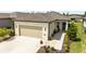 Charming single-story home with well-manicured landscaping, a two-car garage, and a welcoming entrance at 8820 Sw 58Th Street Rd, Ocala, FL 34481