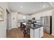 Spacious kitchen with a large island, modern stainless steel appliances, and bar stool seating at 8820 Sw 58Th Street Rd, Ocala, FL 34481