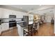 Modern kitchen with stainless steel appliances, a large island, and an open floor plan at 8820 Sw 58Th Street Rd, Ocala, FL 34481