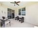 Covered lanai boasts neutral flooring and plenty of space for outdoor furniture and entertaining at 8820 Sw 58Th Street Rd, Ocala, FL 34481