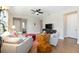 Comfortable living room with modern decor, wood floors, and ceiling fan at 8820 Sw 58Th Street Rd, Ocala, FL 34481