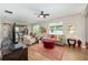 Bright living room with a view into the kitchen and dining area at 8820 Sw 58Th Street Rd, Ocala, FL 34481