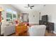 Bright living room with a ceiling fan and comfortable seating arrangement at 8820 Sw 58Th Street Rd, Ocala, FL 34481