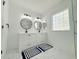 Bright bathroom featuring double sinks, marble floors, and modern fixtures at 9029 Se 135Th Loop, Summerfield, FL 34491
