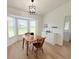 Inviting dining area features large windows and a comfortable table with seating for four at 9029 Se 135Th Loop, Summerfield, FL 34491