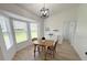 Charming dining area with bright bay windows and a cozy table setting at 9029 Se 135Th Loop, Summerfield, FL 34491
