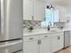 Close up of a modern kitchen with stainless steel appliances and sleek countertops at 9029 Se 135Th Loop, Summerfield, FL 34491