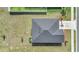 Birds eye view of roof showing the well-kept lawn and simple landscaping at 9266 Sw 58Th Cir, Ocala, FL 34476