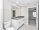 Clean bathroom with granite counters, double sinks and a view into the bedroom at 9266 Sw 58Th Cir, Ocala, FL 34476
