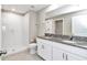 Bathroom with walk-in shower and double sink vanity with granite countertops at 9266 Sw 58Th Cir, Ocala, FL 34476