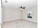 Bright bedroom features a ceiling fan and a large window with a view of the neighborhood at 9266 Sw 58Th Cir, Ocala, FL 34476