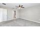 This bedroom includes neutral paint, carpet, and a ceiling fan at 9266 Sw 58Th Cir, Ocala, FL 34476