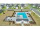 Aerial view of community pool with lounge chairs, shade, and tables at 9266 Sw 58Th Cir, Ocala, FL 34476