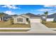 Lovely single-story home with a two-car garage, neat landscaping, and neutral tones blending seamlessly into the suburban street at 9266 Sw 58Th Cir, Ocala, FL 34476