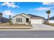 Charming single-story home with a well-maintained lawn, a two-car garage, and a neatly paved driveway at 9266 Sw 58Th Cir, Ocala, FL 34476