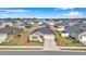 Inviting one-story home featuring a neutral color palette, attached garage, and well-manicured front lawn at 9266 Sw 58Th Cir, Ocala, FL 34476